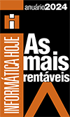 A imagem é um selo de premiação. No lado esquerdo, em fundo laranja, aparece o texto na vertical “INFORMÁTICA HOJE”. No canto superior direito, em branco, lê-se “anuário 2024”. No centro, em fundo preto, está escrito em branco e laranja: “As mais rentáveis”. Na parte inferior há um elemento gráfico em formato de “V” na cor laranja.